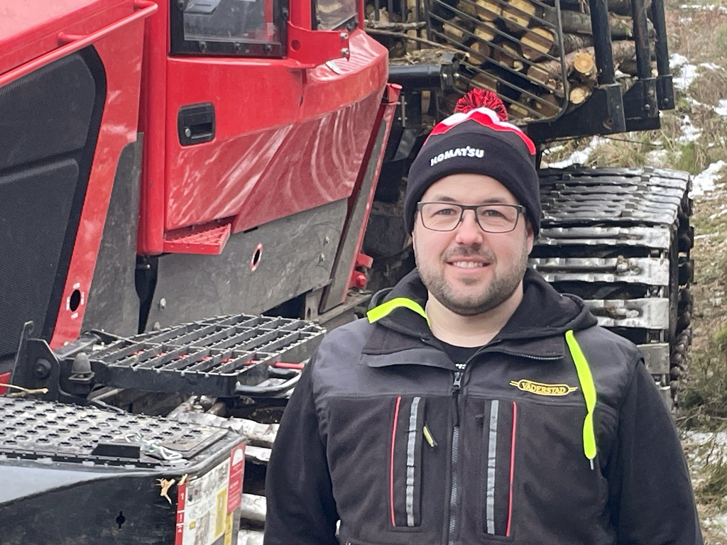 Operator standing in front of his machine